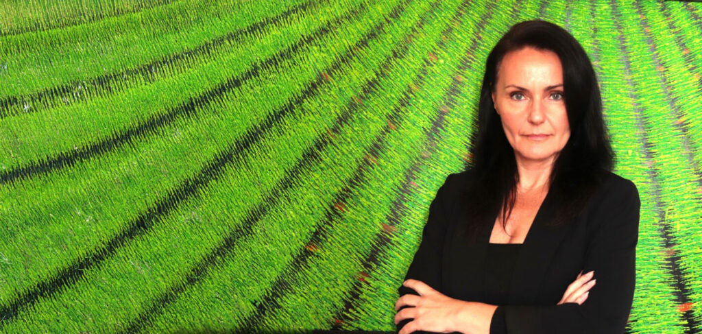 Portrait of Michaela, leadership coach, representing executive presence and confidence.